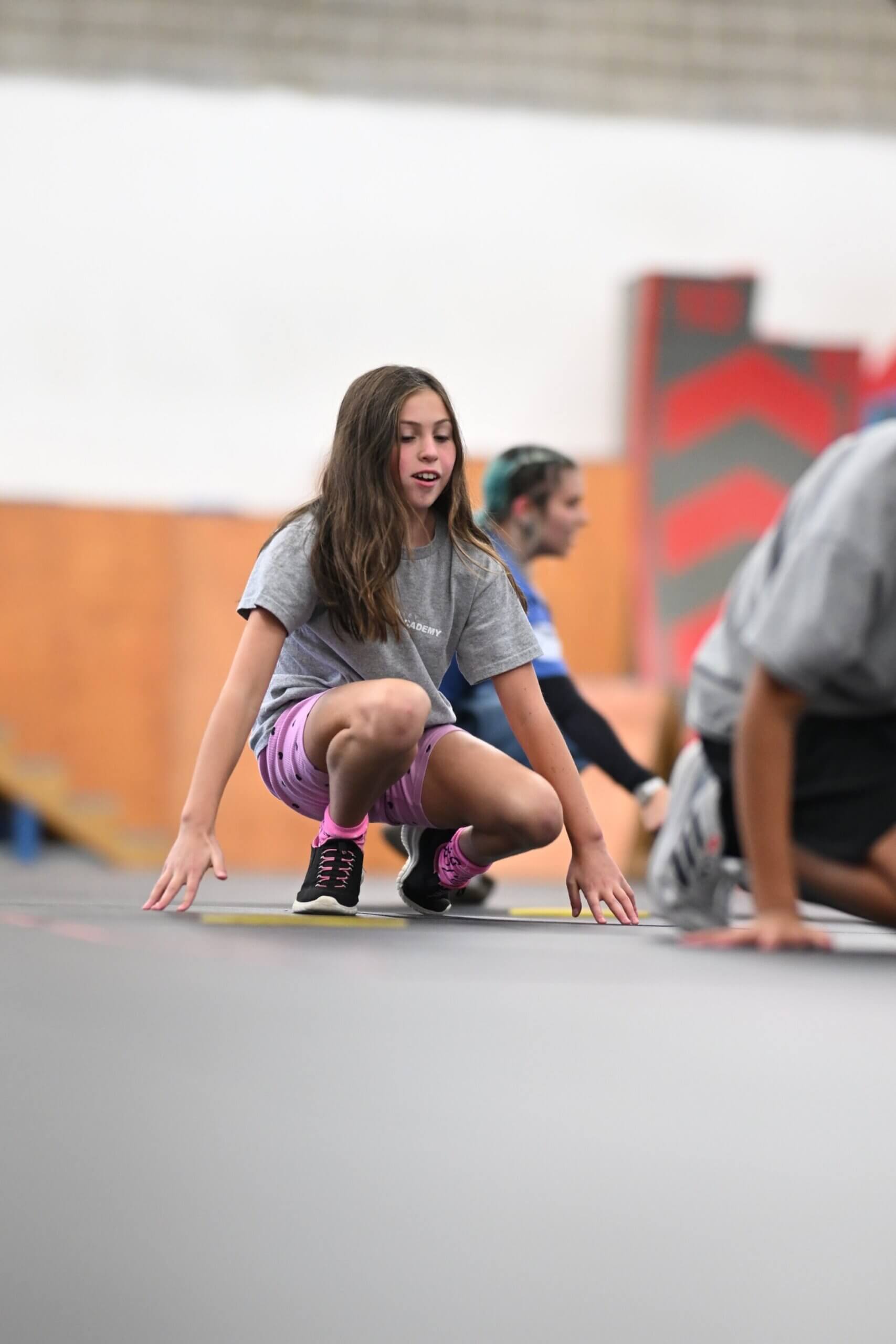 Teen student interacting with classmates at parkour