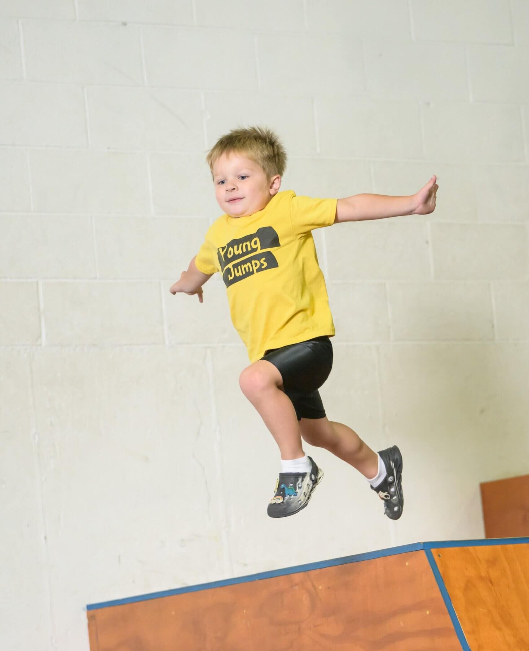 Young Jumps PKR 0052 Preschool student climbing on gym apparatus